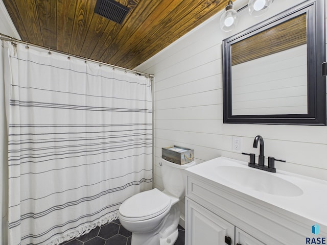 577 60th Ave, Beaver Creek, MN 56116 - full bath with wood ceiling, toilet, tile patterned flooring, vanity, and wood walls