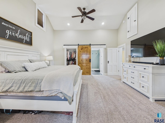 577 60th Ave, Beaver Creek, MN 56116 - bedroom with light colored carpet, a spacious closet, a barn door, a high ceiling, and a closet