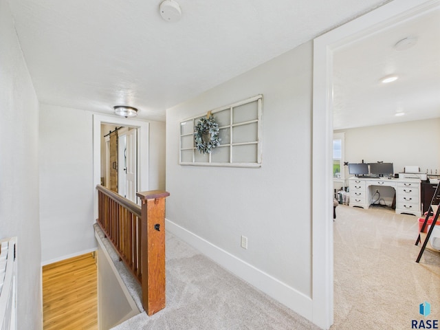 577 60th Ave, Beaver Creek, MN 56116 - hall with an upstairs landing, carpet flooring, a desk, and baseboards