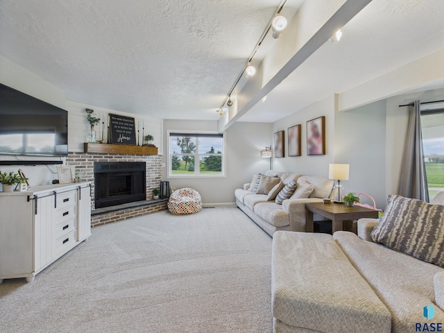 577 60th Ave, Beaver Creek, MN 56116 - carpeted living area featuring a textured ceiling and a brick fireplace