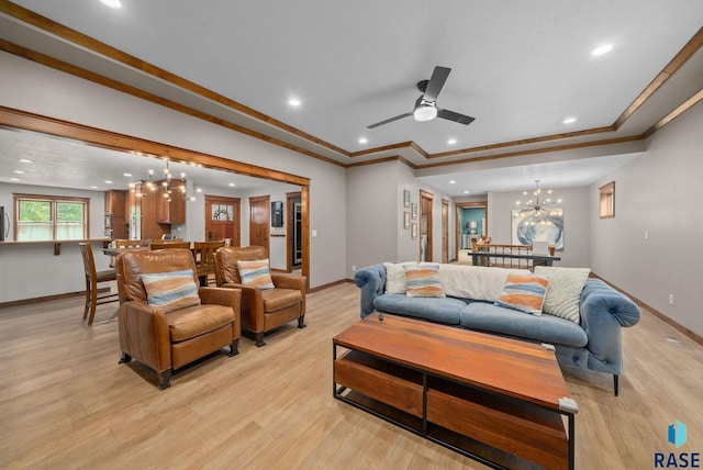 1325 W Whitechurch Ln, Sioux Falls, SD 57108 - living room featuring baseboards, a chandelier, light wood-style floors, recessed lighting, and crown molding