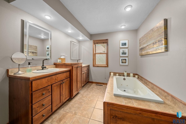 1325 W Whitechurch Ln, Sioux Falls, SD 57108 - full bath featuring vanity, a tub with jets, tile patterned flooring, and recessed lighting