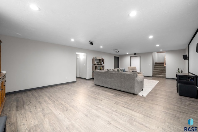 1325 W Whitechurch Ln, Sioux Falls, SD 57108 - living area featuring recessed lighting, stairway, light wood-type flooring, and baseboards