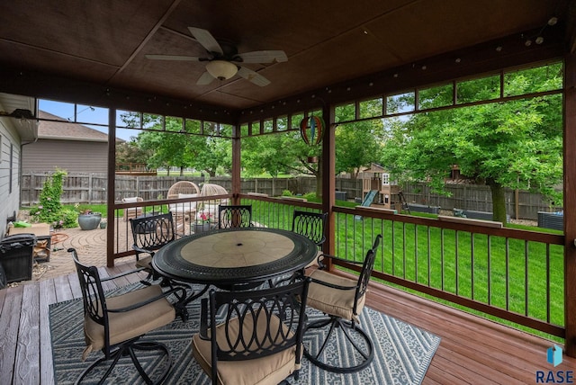 1325 W Whitechurch Ln, Sioux Falls, SD 57108 - wooden deck with outdoor dining area, a playground, and ceiling fan