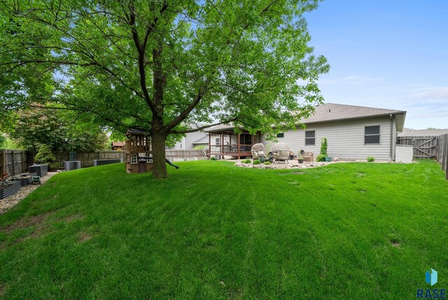 1325 W Whitechurch Ln, Sioux Falls, SD 57108 - view of yard with cooling unit and a patio area