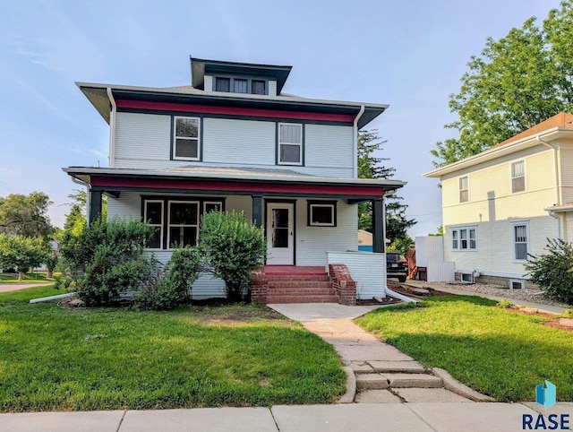 302 E 19th St, Sioux Falls, SD 57105 - american foursquare style home with a porch and a front yard