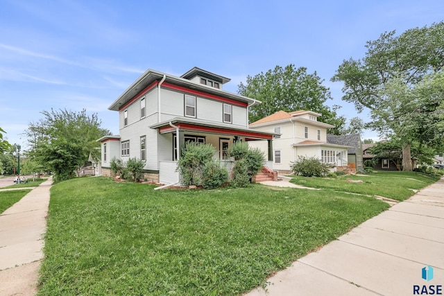 302 E 19th St, Sioux Falls, SD 57105 - traditional style home featuring covered porch and a front lawn