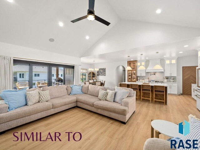 1112 N Slate Ave, Brandon, SD 57005 - living area featuring high vaulted ceiling, light wood-style floors, ceiling fan, recessed lighting, and a chandelier
