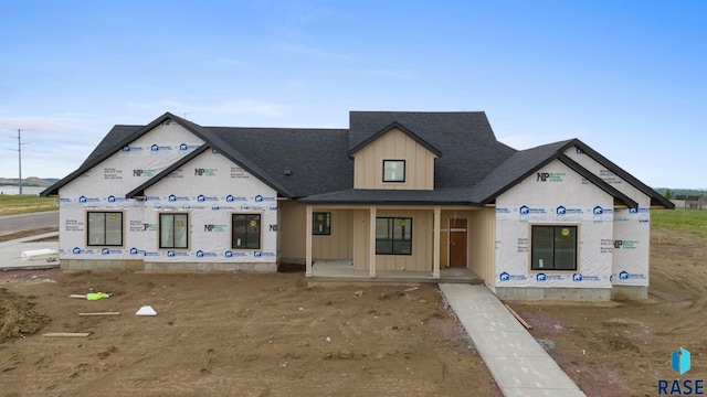1112 N Slate Ave, Brandon, SD 57005 - property in mid-construction with a porch, board and batten siding, and a shingled roof