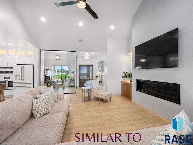 1112 N Slate Ave, Brandon, SD 57005 - living room with high vaulted ceiling, a glass covered fireplace, ceiling fan, light wood-type flooring, and recessed lighting