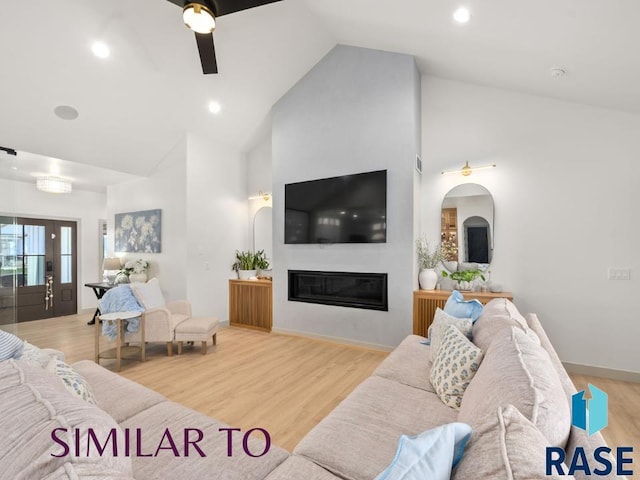 1112 N Slate Ave, Brandon, SD 57005 - living room featuring high vaulted ceiling, a glass covered fireplace, wood finished floors, a ceiling fan, and recessed lighting