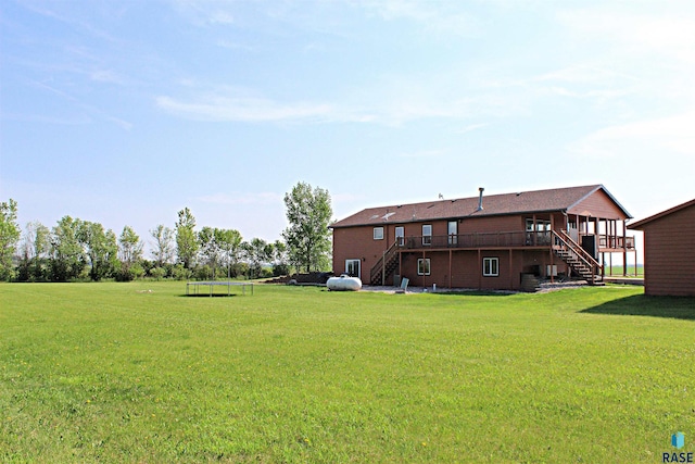 27549 475th Ave, Worthing, SD 57077 - view of grassy yard with stairway and a wooden deck