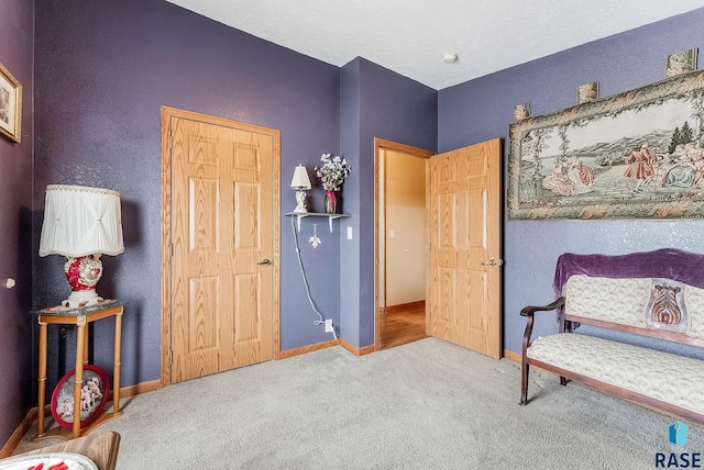 27549 475th Ave, Worthing, SD 57077 - sitting room featuring carpet and baseboards