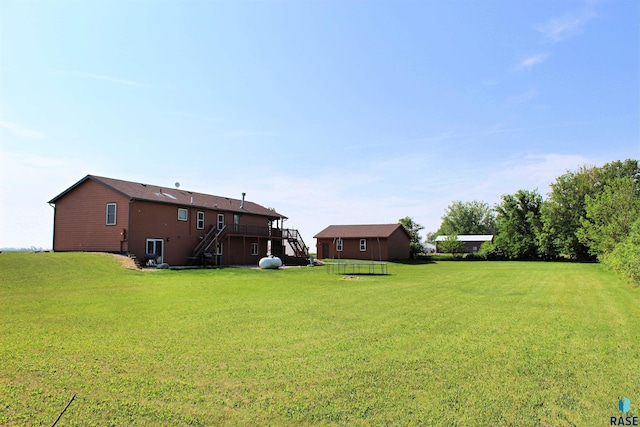 27549 475th Ave, Worthing, SD 57077 - view of green lawn with stairs and a wooden deck