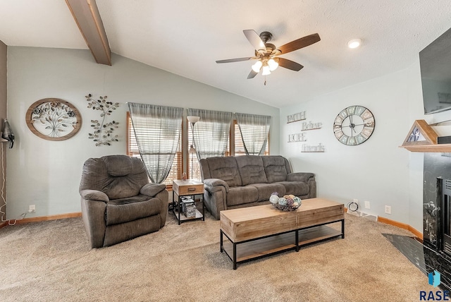 27549 475th Ave, Worthing, SD 57077 - living room featuring a fireplace with flush hearth, light carpet, ceiling fan, and baseboards