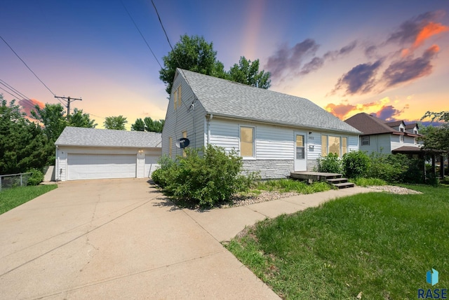 1422 E 17th St, Sioux Falls, SD 57104 - view of front of home with a front lawn, stone siding, and roof with shingles