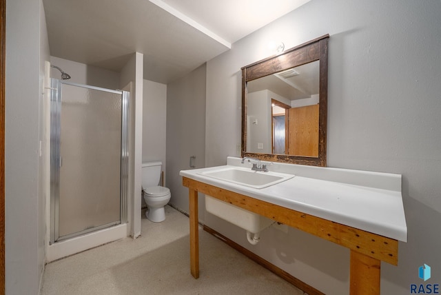 1422 E 17th St, Sioux Falls, SD 57104 - bathroom featuring toilet, a stall shower, and vanity