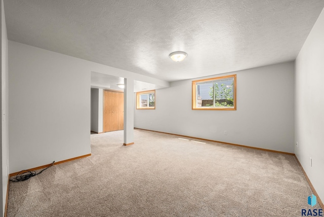 1422 E 17th St, Sioux Falls, SD 57104 - unfurnished room featuring carpet floors, baseboards, and a textured ceiling