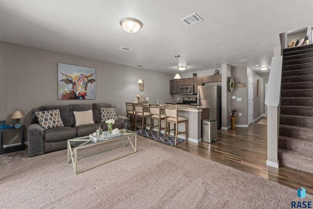 872 S Sycamore Ave Unit 3, Sioux Falls, SD 57110 - living area with stairs, dark wood-style floors, and baseboards