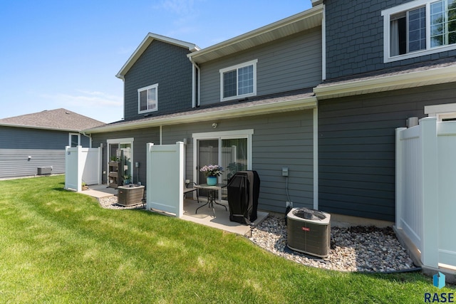 872 S Sycamore Ave Unit 3, Sioux Falls, SD 57110 - back of property featuring central AC unit and a patio area