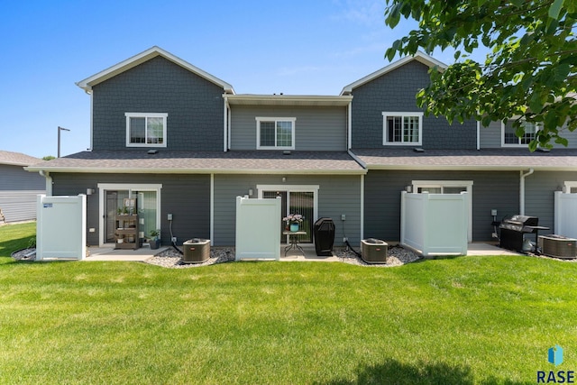 872 S Sycamore Ave Unit 3, Sioux Falls, SD 57110 - back of house with a yard, central air condition unit, and a patio area
