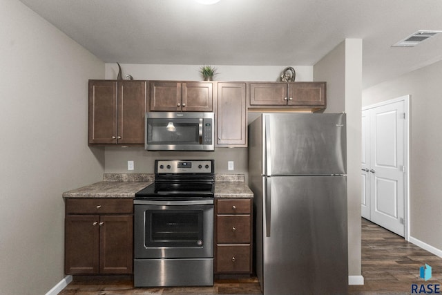 872 S Sycamore Ave Unit 3, Sioux Falls, SD 57110 - kitchen with appliances with stainless steel finishes, baseboards, dark wood finished floors, and dark brown cabinets