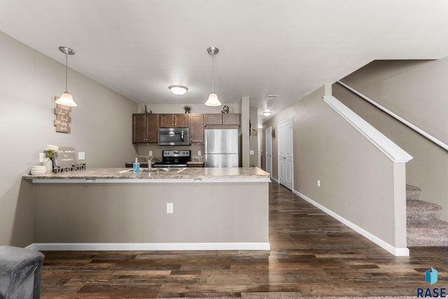 872 S Sycamore Ave Unit 3, Sioux Falls, SD 57110 - kitchen with appliances with stainless steel finishes, a peninsula, dark wood finished floors, and pendant lighting