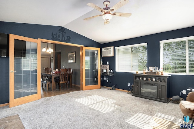 46687 276th St, Lennox, SD 57039 - carpeted living area featuring vaulted ceiling, a wall mounted AC, baseboards, ceiling fan, and a chandelier