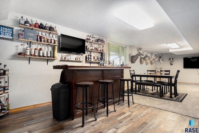 46687 276th St, Lennox, SD 57039 - indoor dry bar featuring wood finished floors and baseboards