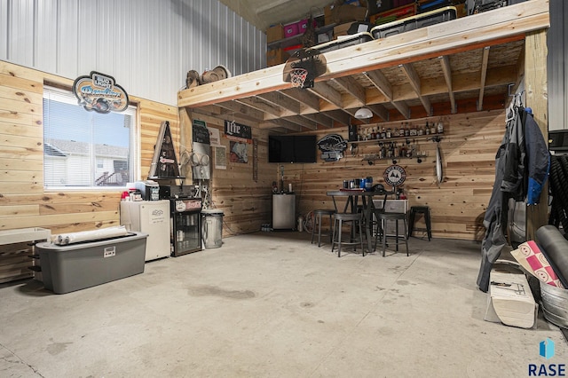 46687 276th St, Lennox, SD 57039 - garage featuring wood walls and a workshop area