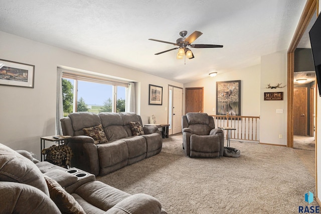 46687 276th St, Lennox, SD 57039 - living room featuring ceiling fan, carpet floors, vaulted ceiling, and baseboards