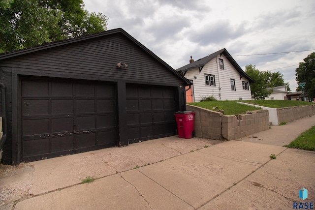 1700 E 7th St, Sioux Falls, SD 57103 - view of side of home with a garage and an outbuilding