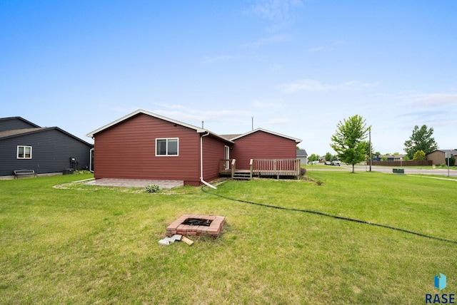 510 Kent St, Harrisburg, SD 57032 - view of grassy yard featuring an outdoor fire pit and a wooden deck
