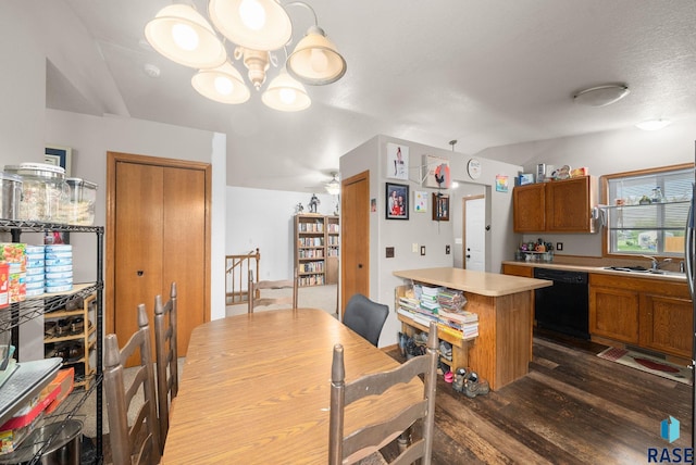 510 Kent St, Harrisburg, SD 57032 - dining room with dark wood finished floors, a chandelier, and lofted ceiling