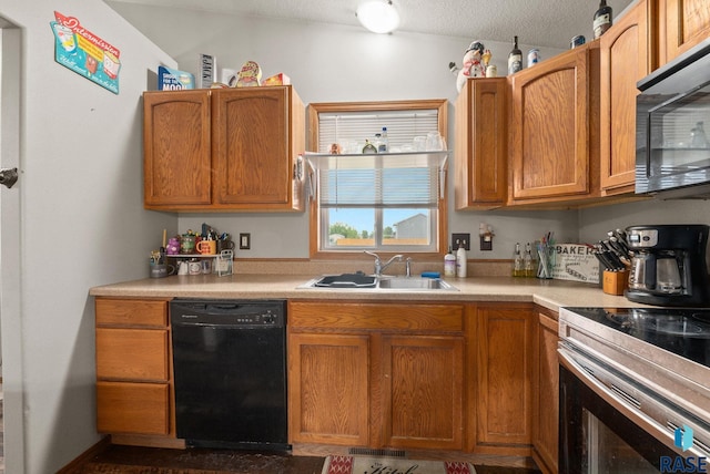 510 Kent St, Harrisburg, SD 57032 - kitchen featuring black appliances, a sink, light countertops, brown cabinetry, and a textured ceiling