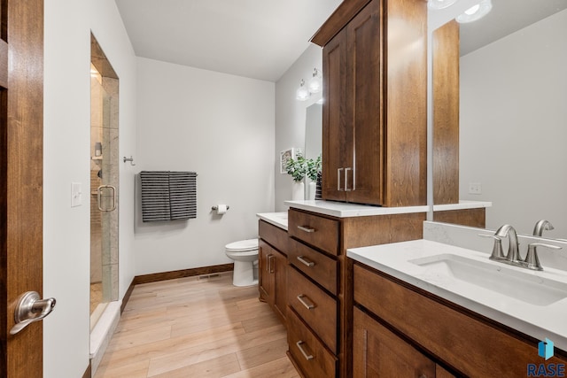 5604 E Daybreak Cir, Sioux Falls, SD 57110 - full bathroom with vanity, toilet, a shower stall, and baseboards