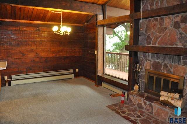 8740 Westview Rd, Brookings, SD 57006 - unfurnished living room featuring wood ceiling, wooden walls, baseboard heating, a chandelier, and carpet floors