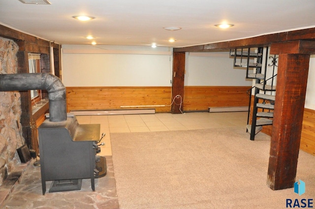 8740 Westview Rd, Brookings, SD 57006 - finished basement featuring a baseboard radiator, baseboard heating, stairs, and wood walls