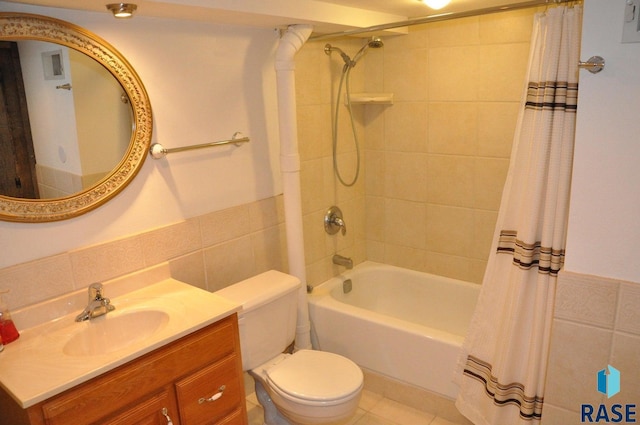 8740 Westview Rd, Brookings, SD 57006 - bathroom featuring tile walls, toilet, vanity, shower / tub combo with curtain, and wainscoting