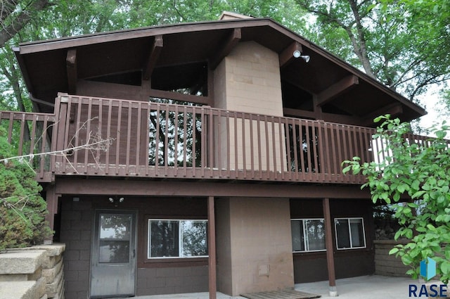 8740 Westview Rd, Brookings, SD 57006 - back of house with concrete block siding, a balcony, and a patio