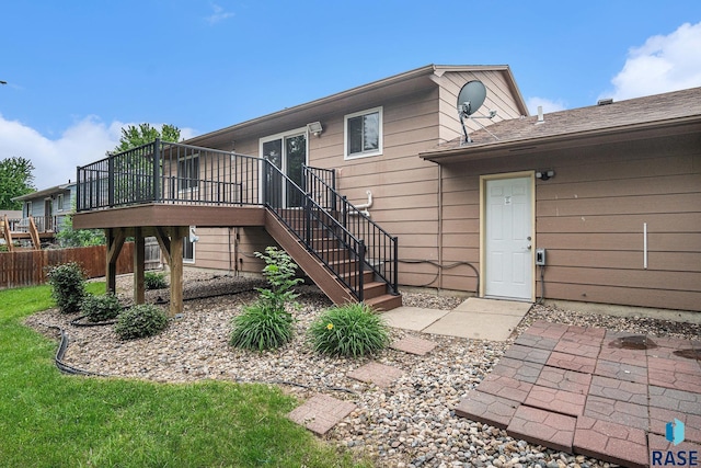 905 S Suburban Dr, Sioux Falls, SD 57110 - rear view of house featuring a wooden deck and stairs