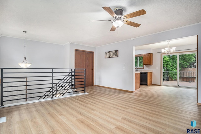 905 S Suburban Dr, Sioux Falls, SD 57110 - empty room featuring crown molding, a chandelier, light wood-style flooring, baseboards, and a ceiling fan
