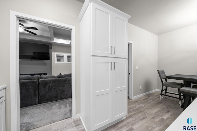 9001 W Rathburn St, Sioux Falls, SD 57103 - dining area with a ceiling fan, light wood-style floors, and baseboards