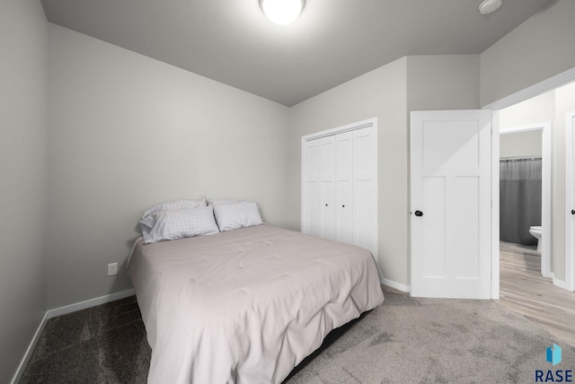 9001 W Rathburn St, Sioux Falls, SD 57103 - bedroom with baseboards, carpet floors, and a closet