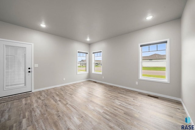 9001 W Rathburn St, Sioux Falls, SD 57103 - spare room with light wood-style floors, baseboards, and recessed lighting