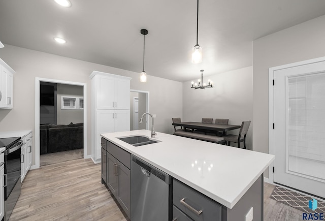 9001 W Rathburn St, Sioux Falls, SD 57103 - kitchen with stainless steel appliances, a sink, gray cabinets, white cabinetry, and recessed lighting