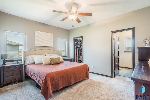 2604 S Ronell Cir, Sioux Falls, SD 57106 - bedroom with light colored carpet, a walk in closet, multiple windows, and a closet
