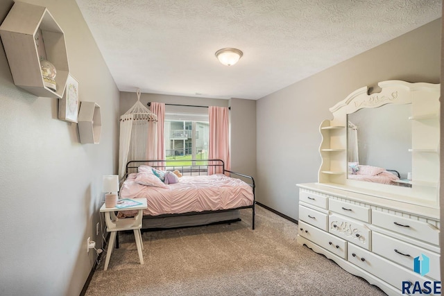 2604 S Ronell Cir, Sioux Falls, SD 57106 - bedroom with light colored carpet, baseboards, and a textured ceiling