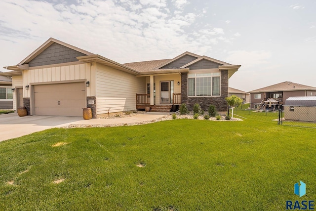 2604 S Ronell Cir, Sioux Falls, SD 57106 - view of front of house with a garage, driveway, and stone siding
