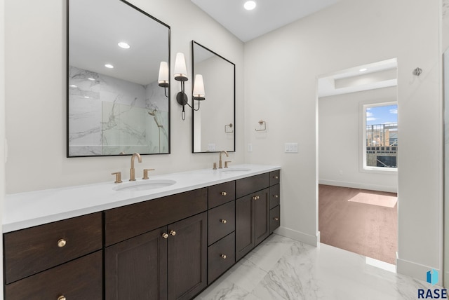 8309 E Sheridan Cir, Sioux Falls, SD 57110 - full bath with double vanity, a marble finish shower, recessed lighting, marble finish flooring, and baseboards
